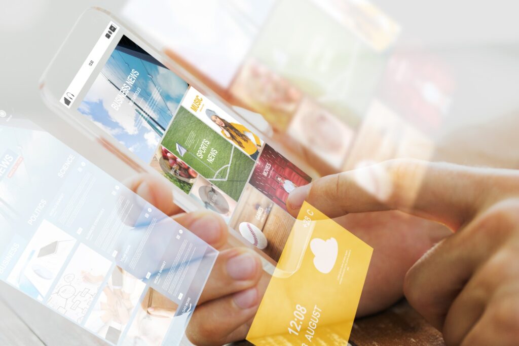 A person holds a mobile phone. Overlaying the image of the phone is a number of overlapping images showing various apps and services on a phone